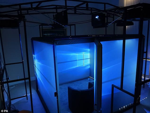 Photo of the Blue Room itself showing the Windows 10 wallpaper on each side.